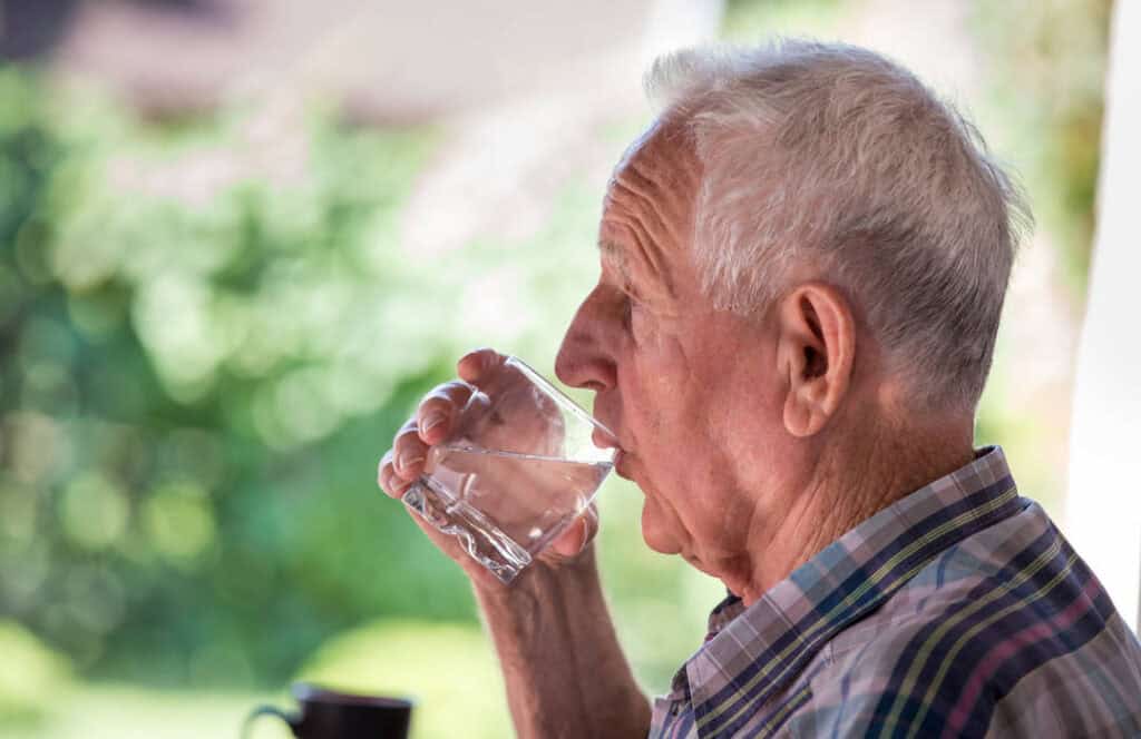 man drinking water