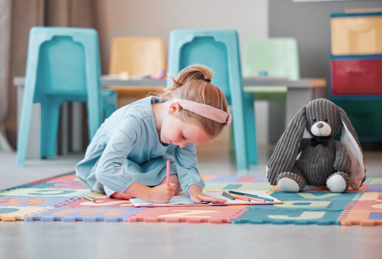 notebook,,teddy,bear,and,young,child,writing,in,psychology,office